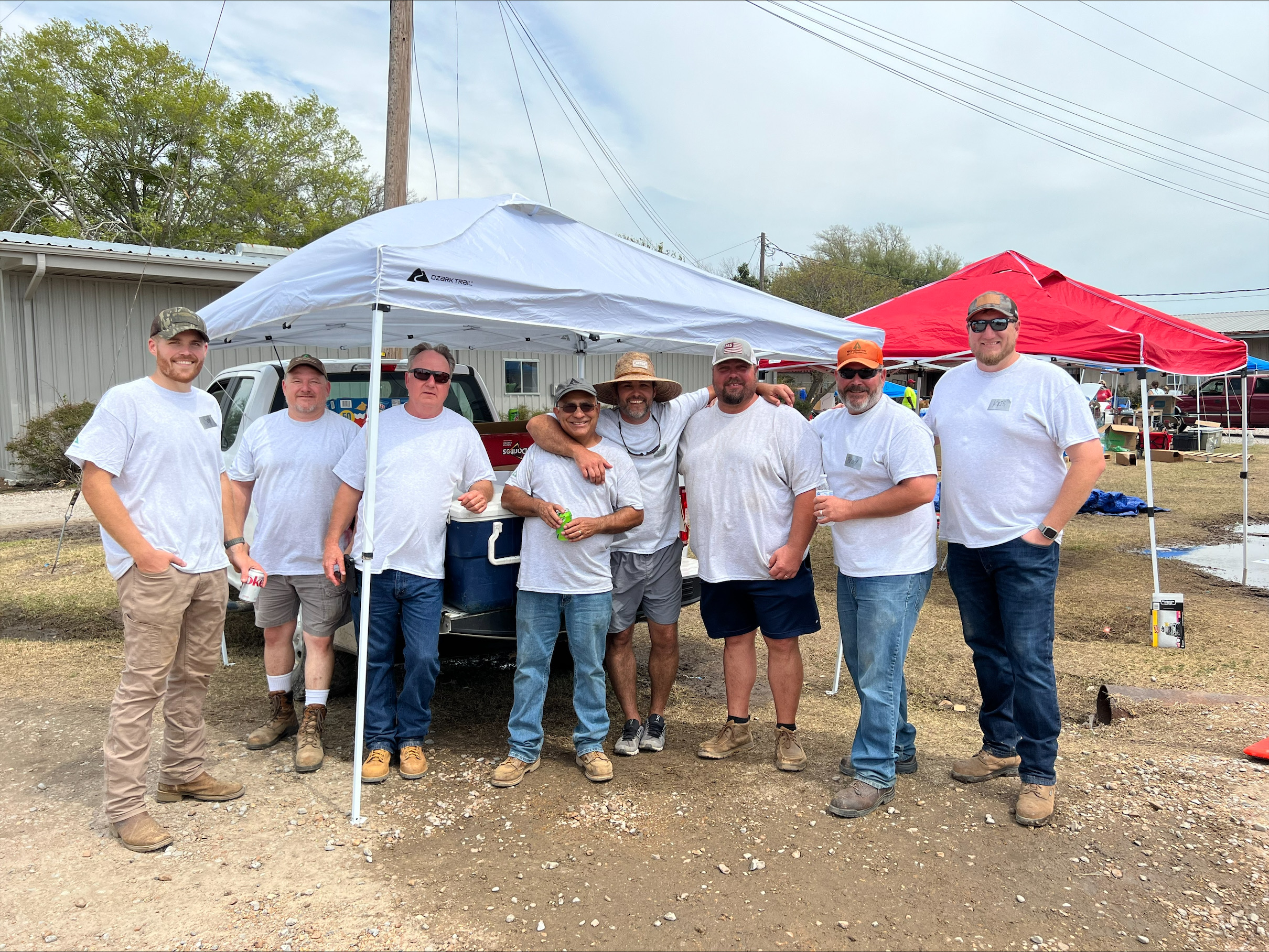 Image of employees supporting victims of a tornado in Mississippi.
